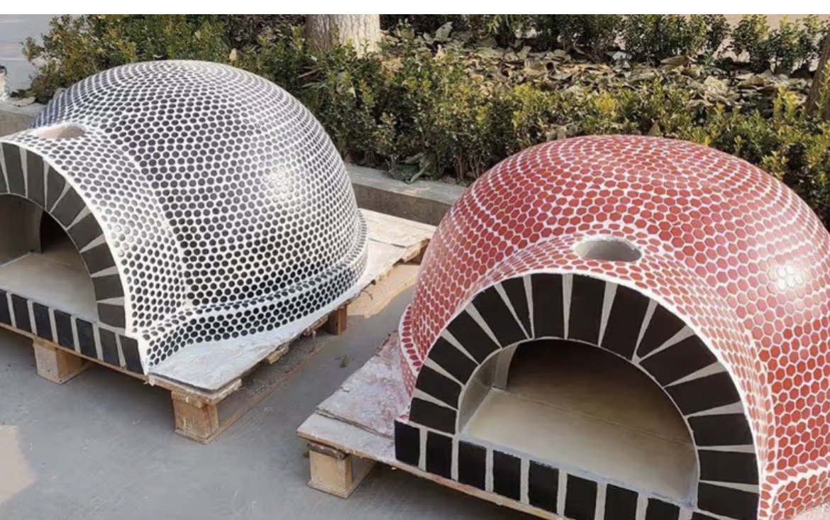 Black-and-white and red mosaic tile pizza ovens shown side by side